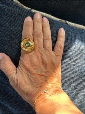 UNO de 50 Gold Tone Evil Eye Ring with Green Faceted Stone